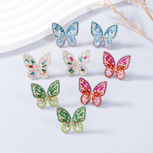 Glittering Rhinestone Butterfly Earrings with an elegant alloy base and intricately inlaid rhinestones.