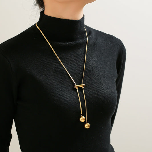 Luxe 18K Gold Plated Titanium Steel Hollow Bead Necklace featuring modern hollow beads and 18K gold plating.