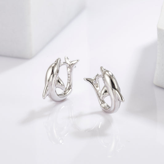 Sterling Silver Zircon Dolphin Earrings featuring dolphin-shaped designs adorned with sparkling zircon stones.