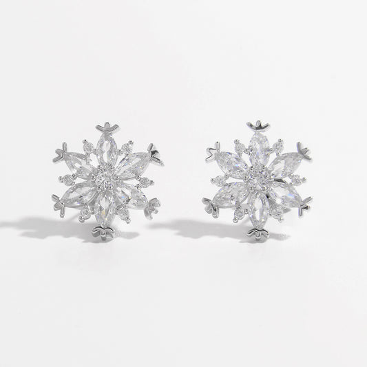 Sterling Silver Zircon Snowflake Earrings featuring intricate snowflake designs adorned with radiant zircon stones.