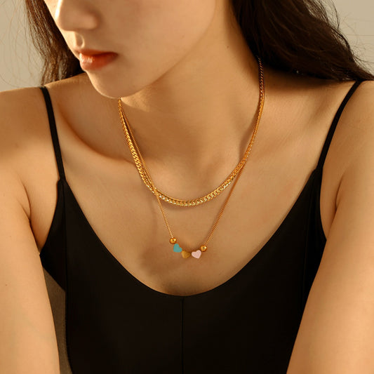 Luxe 18K Gold Plated Double Layered Heart Necklace featuring two heart-shaped pendants on layered chains.